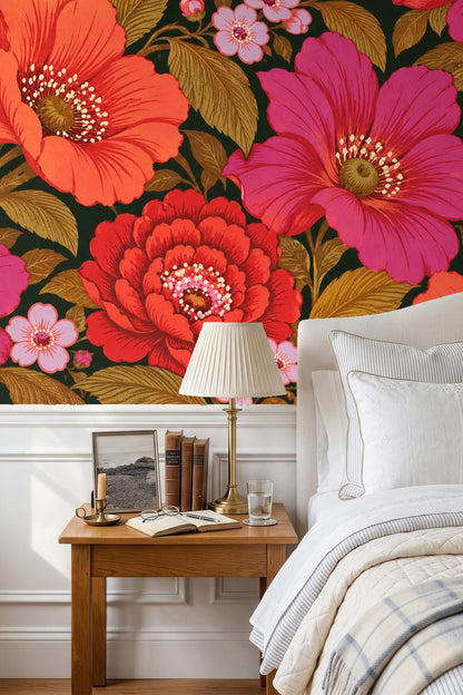 Close-up view of bold coral and magenta floral wallpaper with detailed leaves