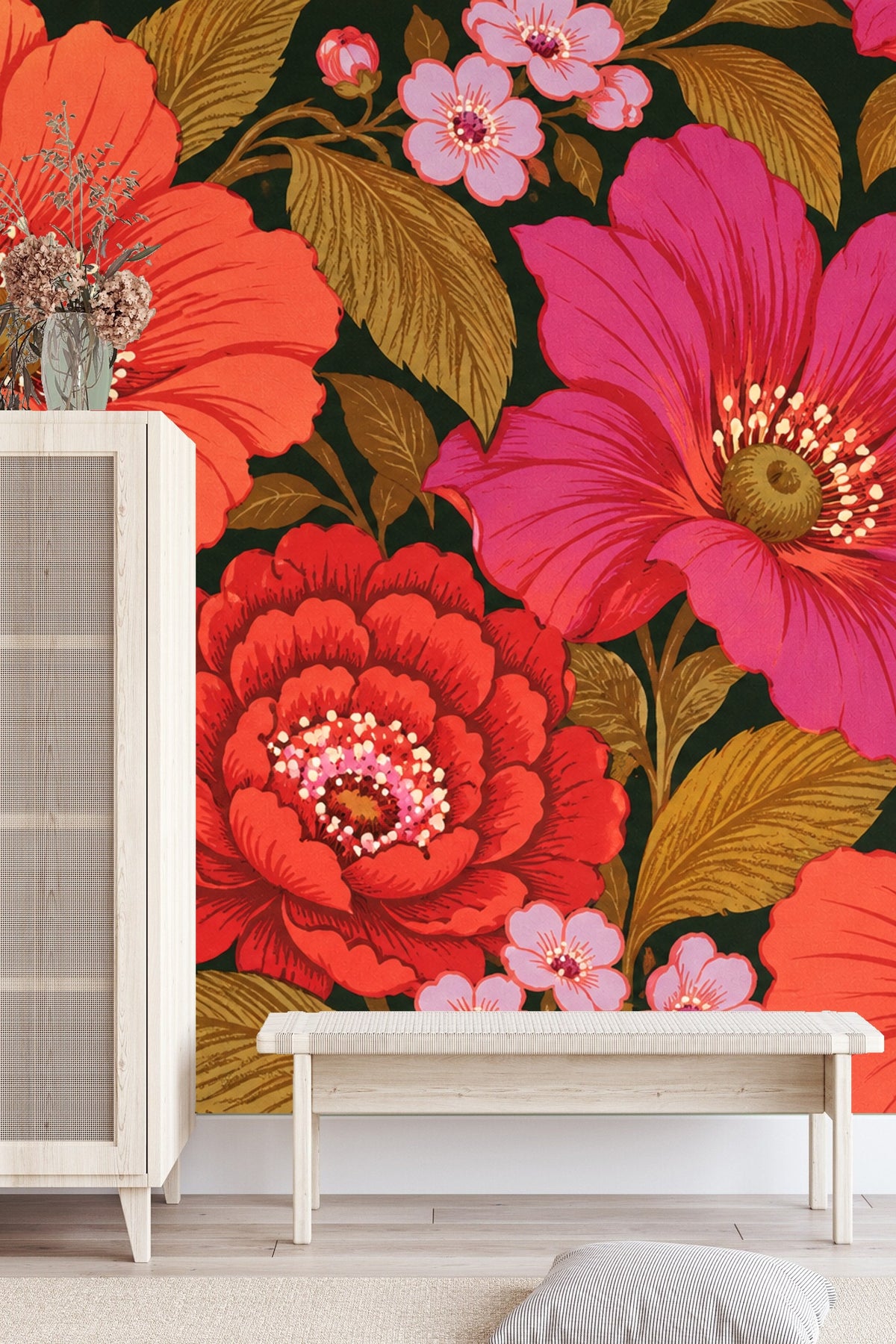 Bedroom scene with bold coral and magenta floral wallpaper behind white upholstered bed and wooden bedside table