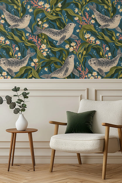 Close-up of wallpaper pattern showing four animated harbor seals swimming among flowing kelp