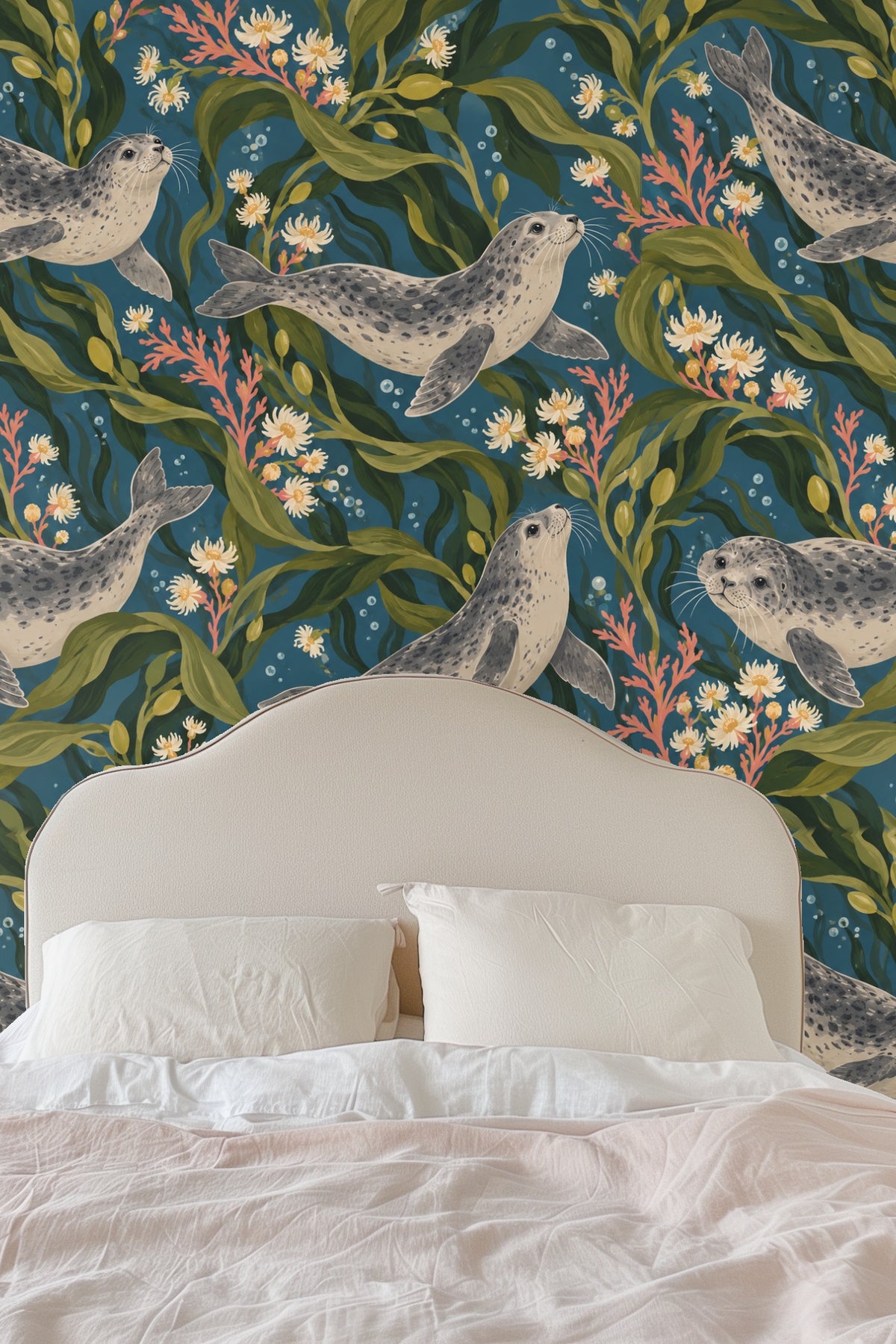 Living room with plush pink sofa and harbor seal wallpaper mural featuring green kelp and coral pink flowers