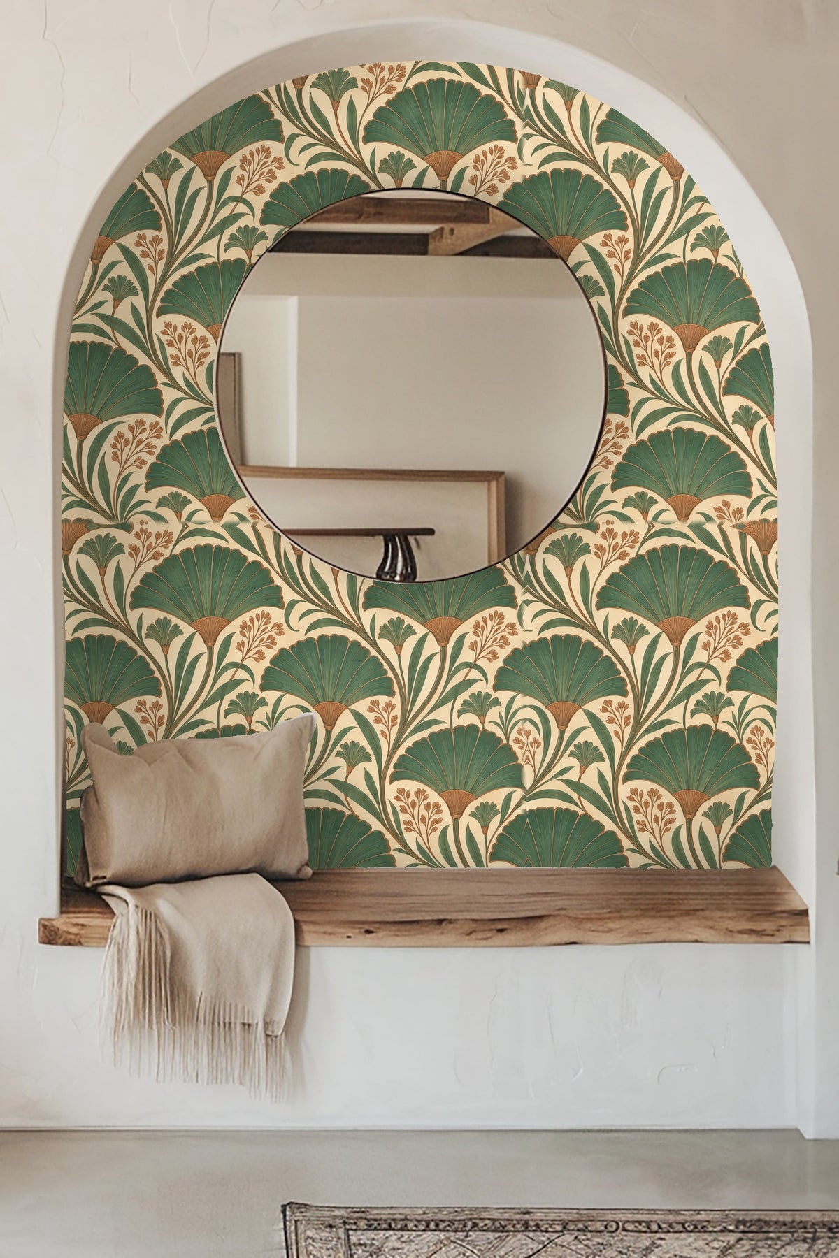 Living room styled with bold green and brown fan foliage wallpaper behind an orange sofa