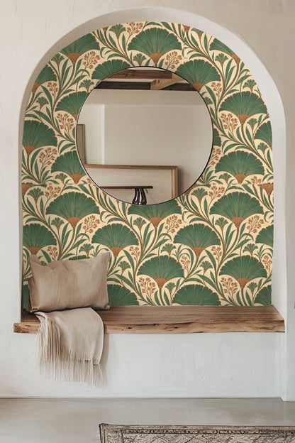 Living room styled with bold green and brown fan foliage wallpaper behind an orange sofa