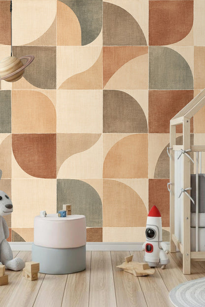Children's room with wallpaper of large quarter circles in warm clay shades and muted sage