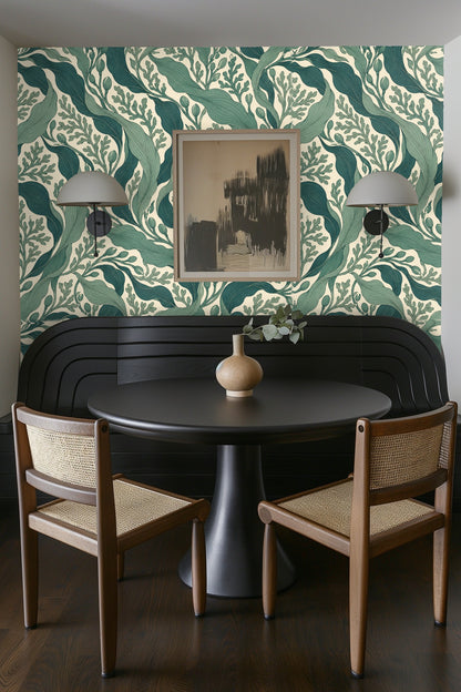 Composition of teal and jade leaves artistically flowing over soft cream background.