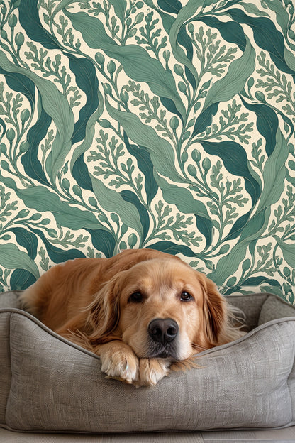 Repeating wallpaper pattern of flowing green leaves and buds with fine line detail on cream background.