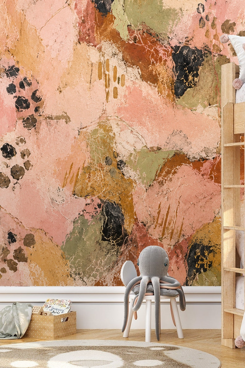 Artistic abstract wallpaper in warm earthy colors shown in nursery interior