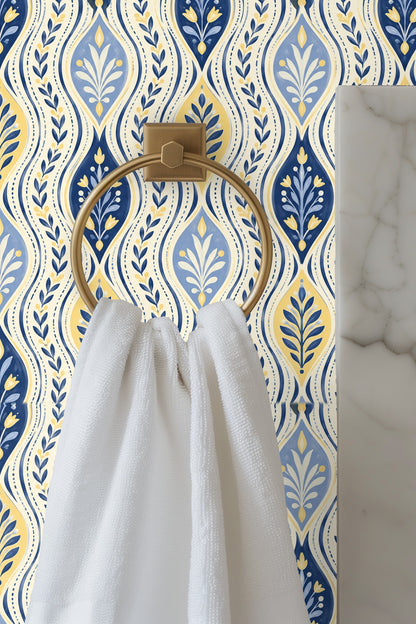 Close-up of hand-rendered floral and leaf motifs on blue and gold wave patterned wallpaper