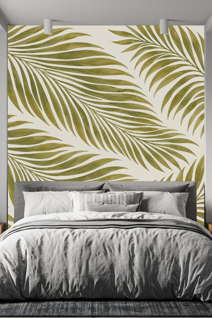 Bedroom wall behind bed with Olive Frond Cascade wallpaper in olive and white, creating a bold botanical backdrop