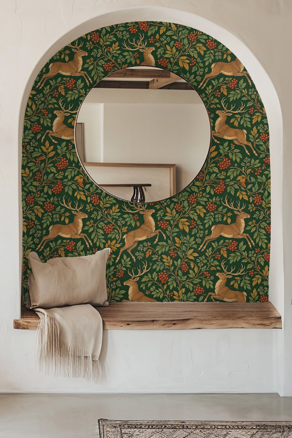 Bathroom interior with regal stag and rowan wallpaper behind a modern mirror, marble countertop, and gold fixtures.
