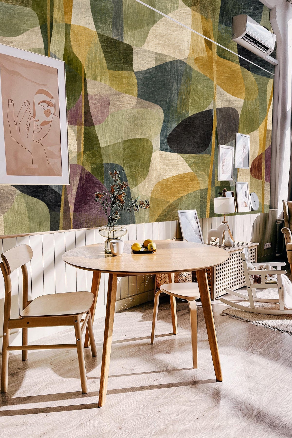 Neutral living room wall covered in artful olive and gold abstract wallpaper.