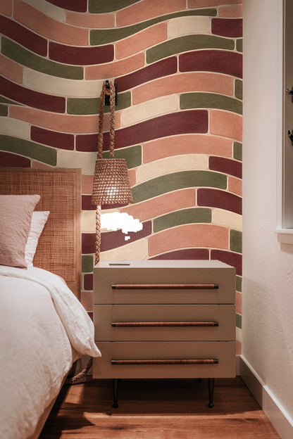 Cream sofa with white pillows beneath terracotta wave tile wallpaper.