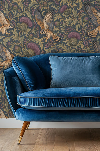 Living room with orange sofa and wallpaper featuring flying kestrels and thistles