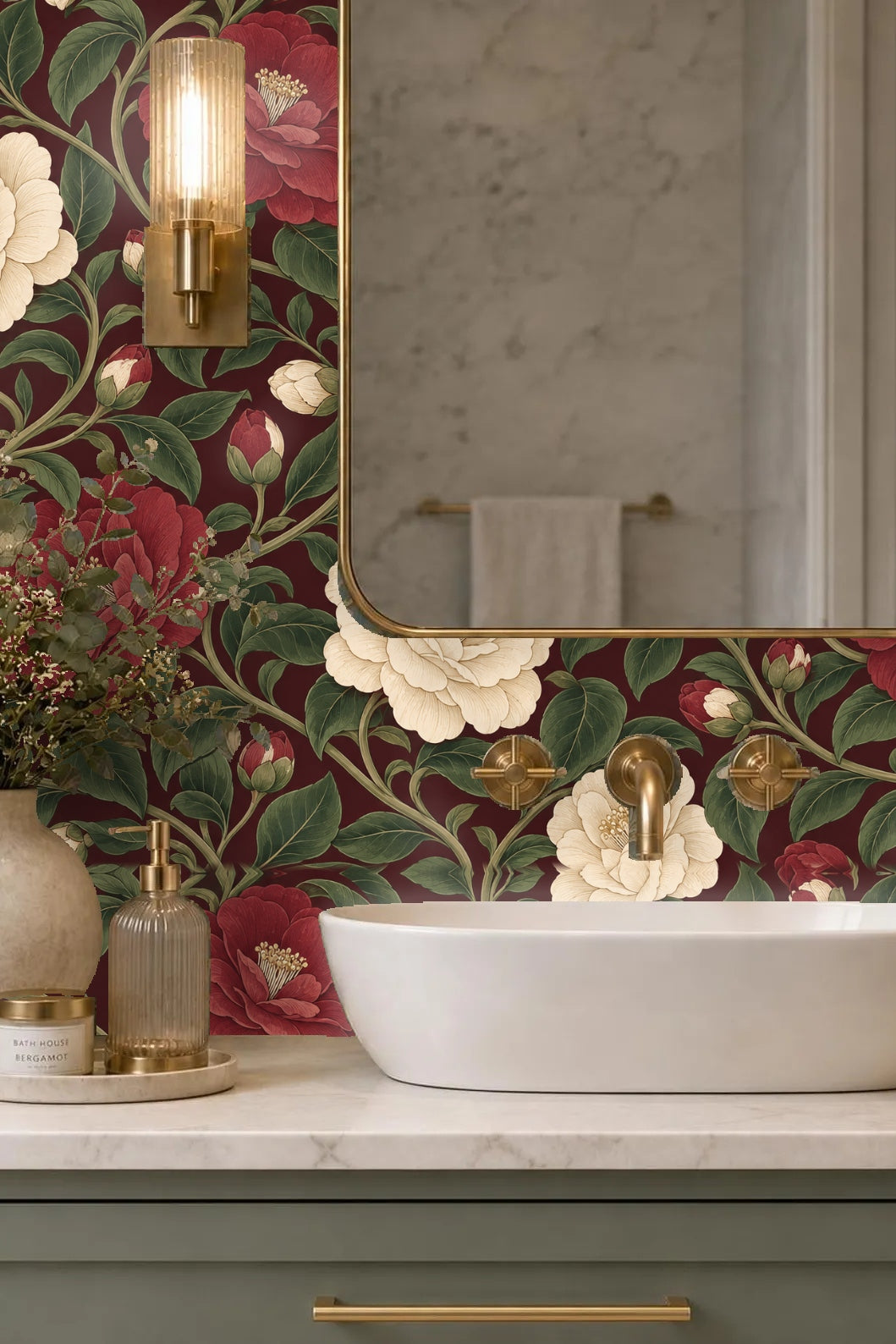Bright living room with white sofa and wooden coffee table showcasing wallpaper of large red and cream camellias and green leaves on burgu