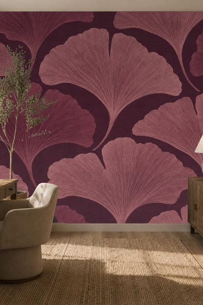 Partial view of wallpaper roll displaying deep plum and mauve ginkgo leaf pattern