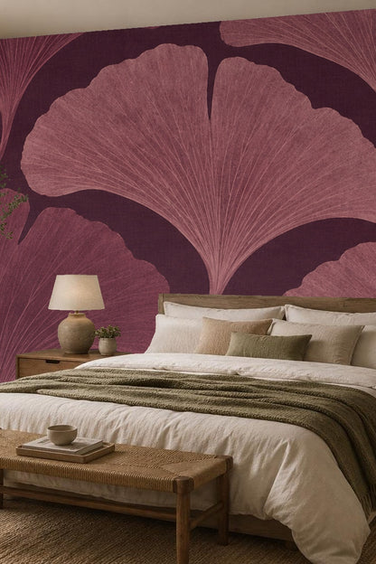 Child's room corner featuring oversized plum ginkgo leaf wallpaper with a woven basket and star toy