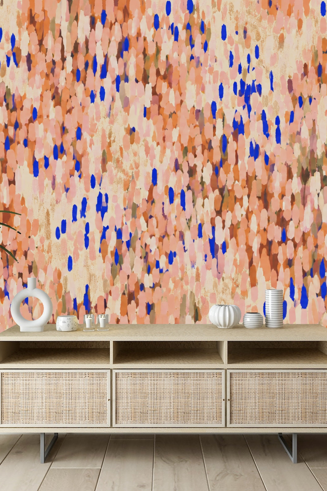 Close view of wallpaper pattern showing layered brushstroke petals in coral and cobalt