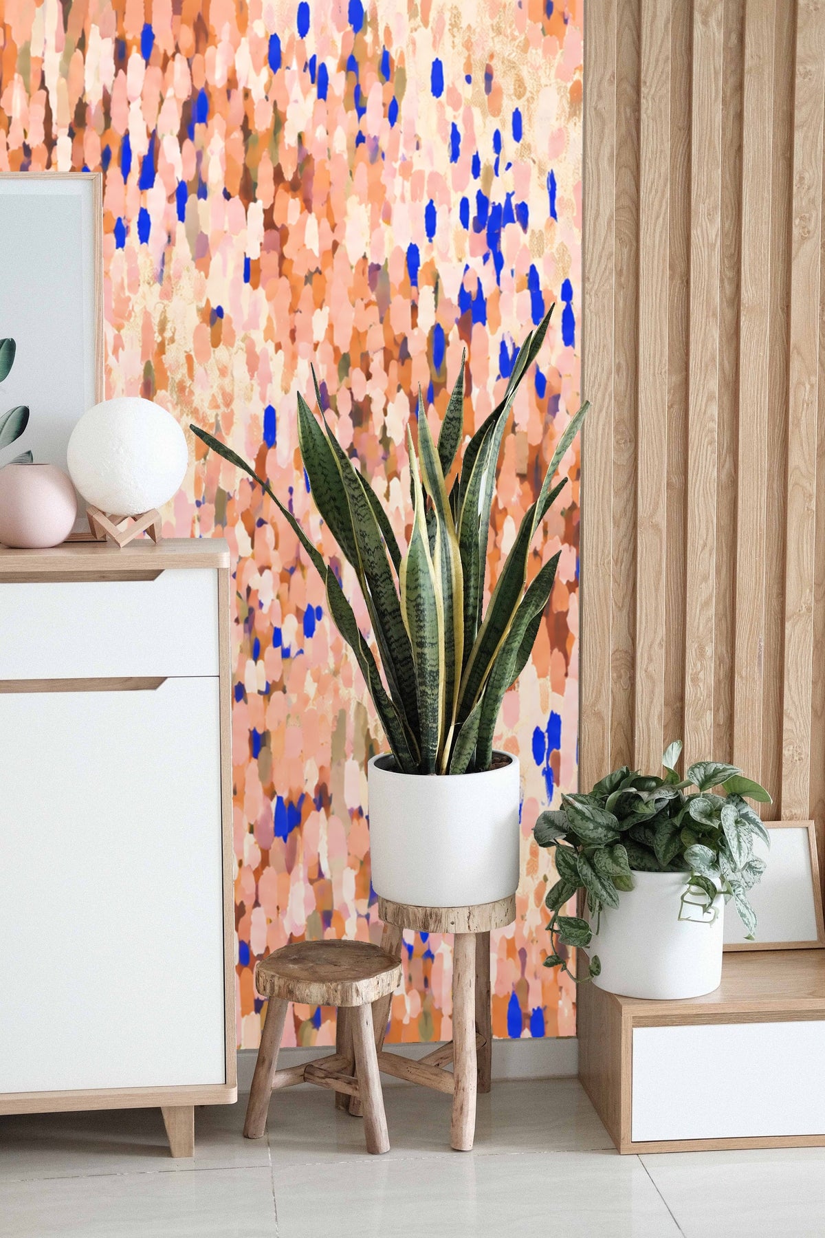 Coral and cobalt impressionist petal wallpaper creating a soft textured effect