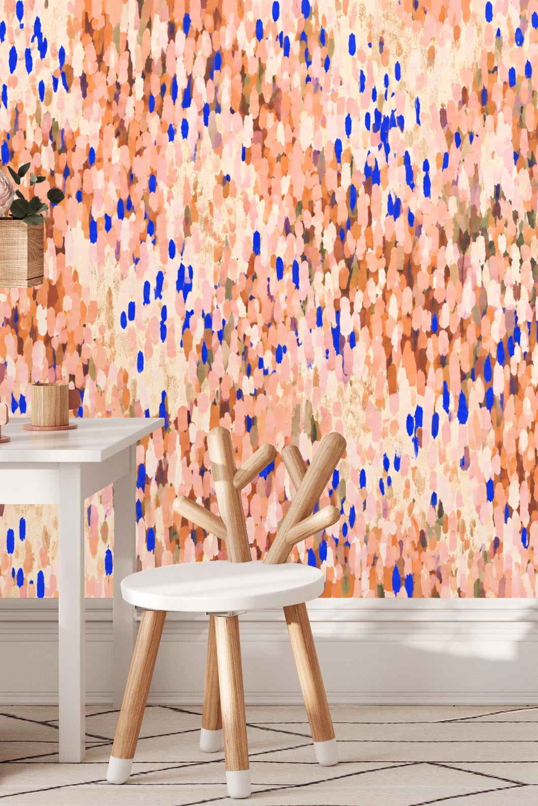 Wallpaper detail with vibrant blue dots accentuating coral and peach blush background