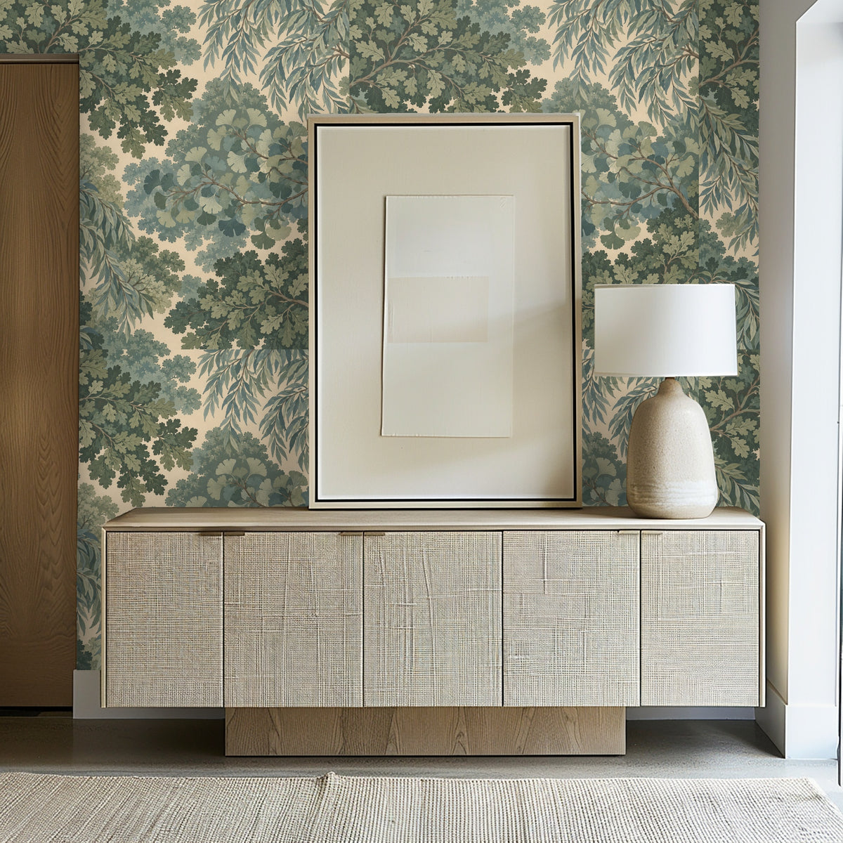 Entryway vignette with the wallpaper behind a textured wood console and framed neutral artwork
