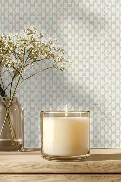 Bedroom wall decorated with the woven light grid wallpaper behind a white cushioned seat