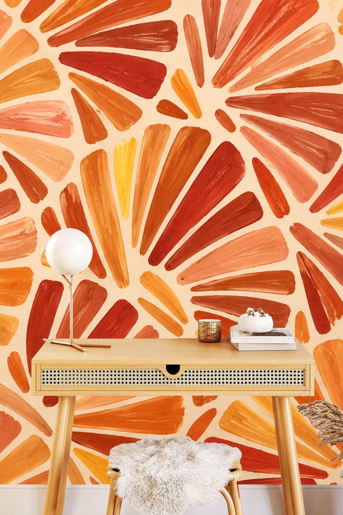 Detailed view of overlapping fan-shaped brushstrokes in various shades of orange and ochre on cream background