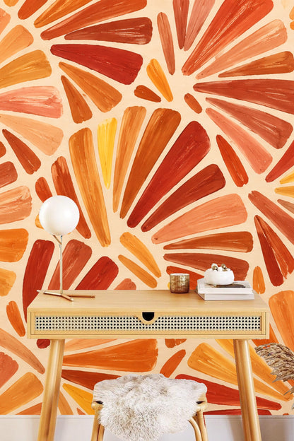 Detailed view of overlapping fan-shaped brushstrokes in various shades of orange and ochre on cream background