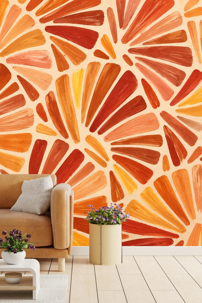 Sunlit room corner with bold orange fan motif wallpaper and minimalist furniture