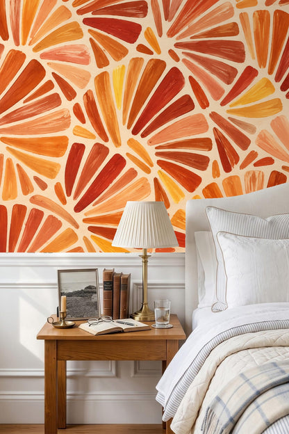 Nursery with mid-century wooden crib against wall decorated in warm terracotta fan motif wallpaper