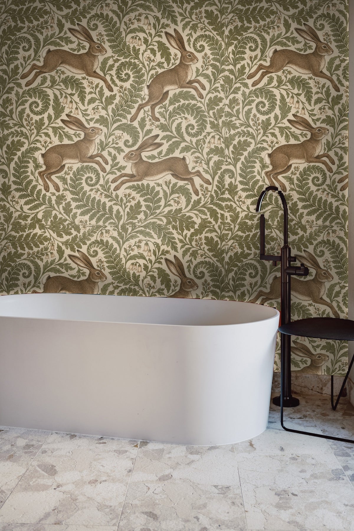 Detailed view of hare's fur texture and leafy botanical scroll on wallpaper
