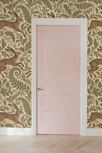 Segment of wallpaper showing hare in mid-leap amid curling botanical leaves and bell flowers