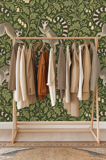 Wall sconce with glass shade illuminating wallpaper with botanical pattern and lemurs