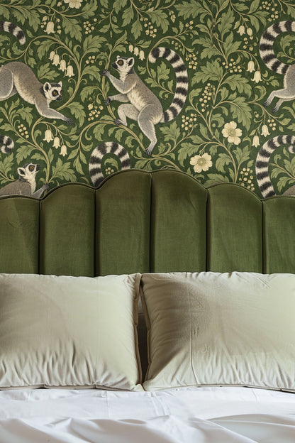 Wallpaper detail showing lemurs among green leafy botanical scroll pattern