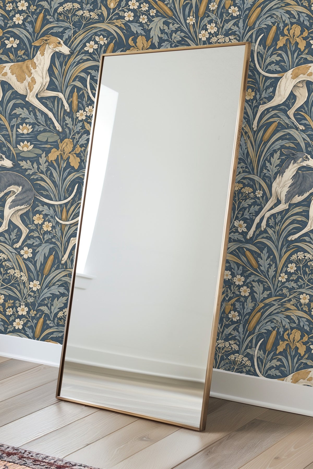 View of a corner wall in room fully covered with blue and gold botanical wallpaper featuring running dogs