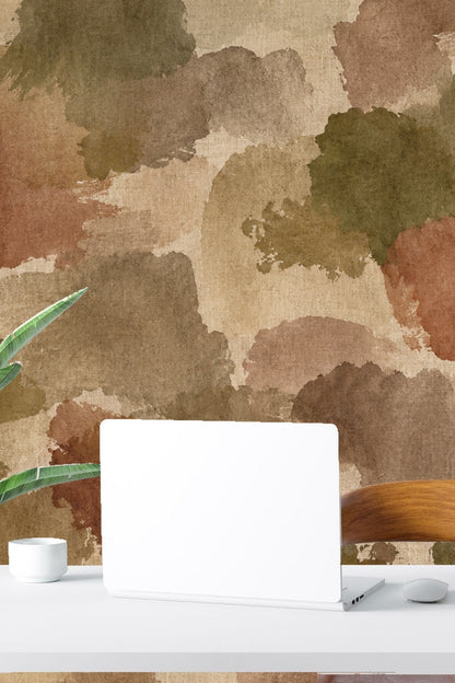 Bedroom with wooden bed and muted watercolor blotch wallpaper