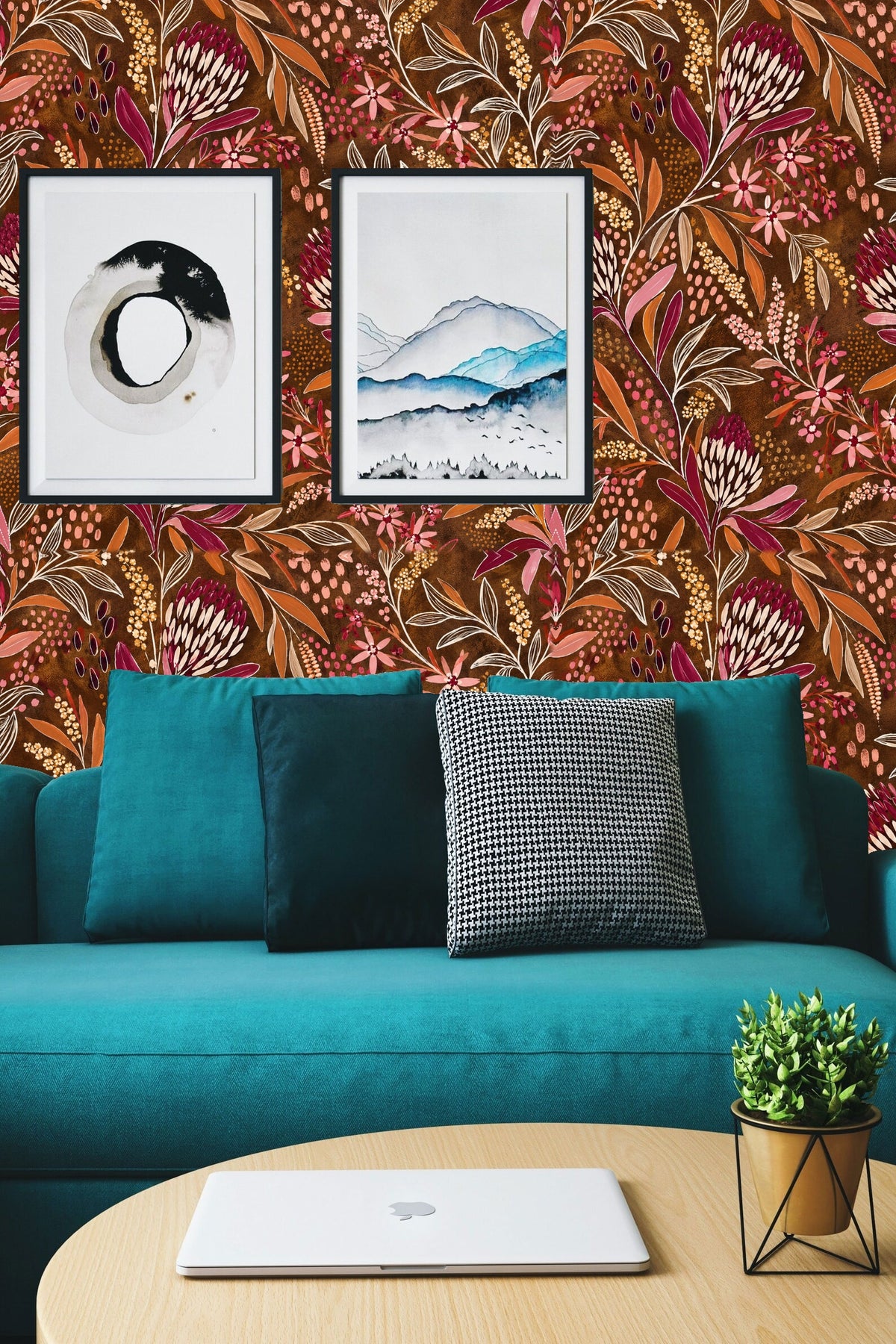 Wide view showing wallpaper behind light wood furniture and simple white flower decor