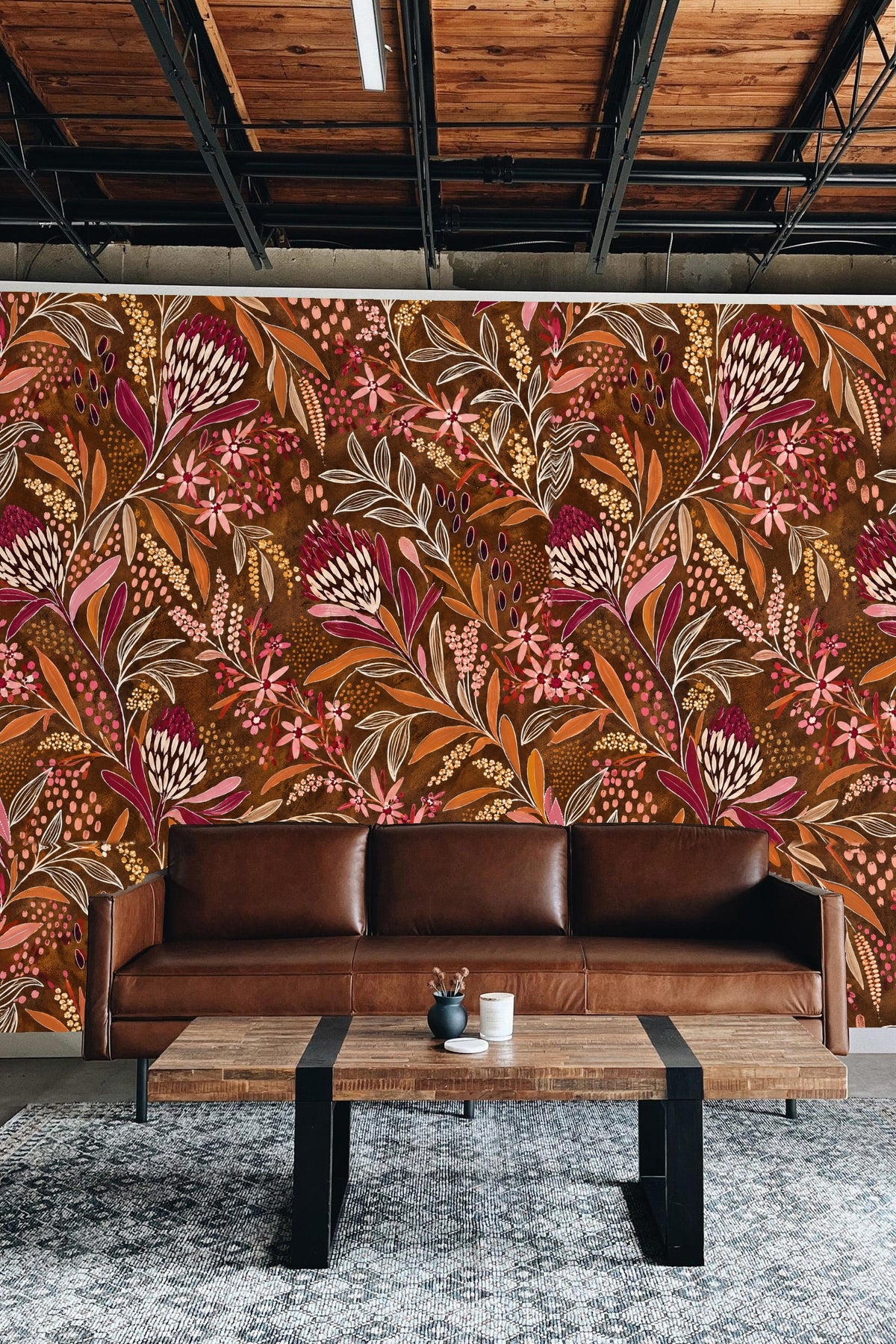 Close-up detail of pressed protea flowers and mixed blossoms on warm brown background wallpaper