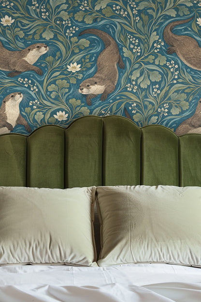 Bedroom wall with wallpaper featuring otters swimming in leafy blue water, paired with an olive green headboard