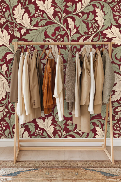 Living room scene showcasing bold leaf wallpaper behind mid-century orange couch