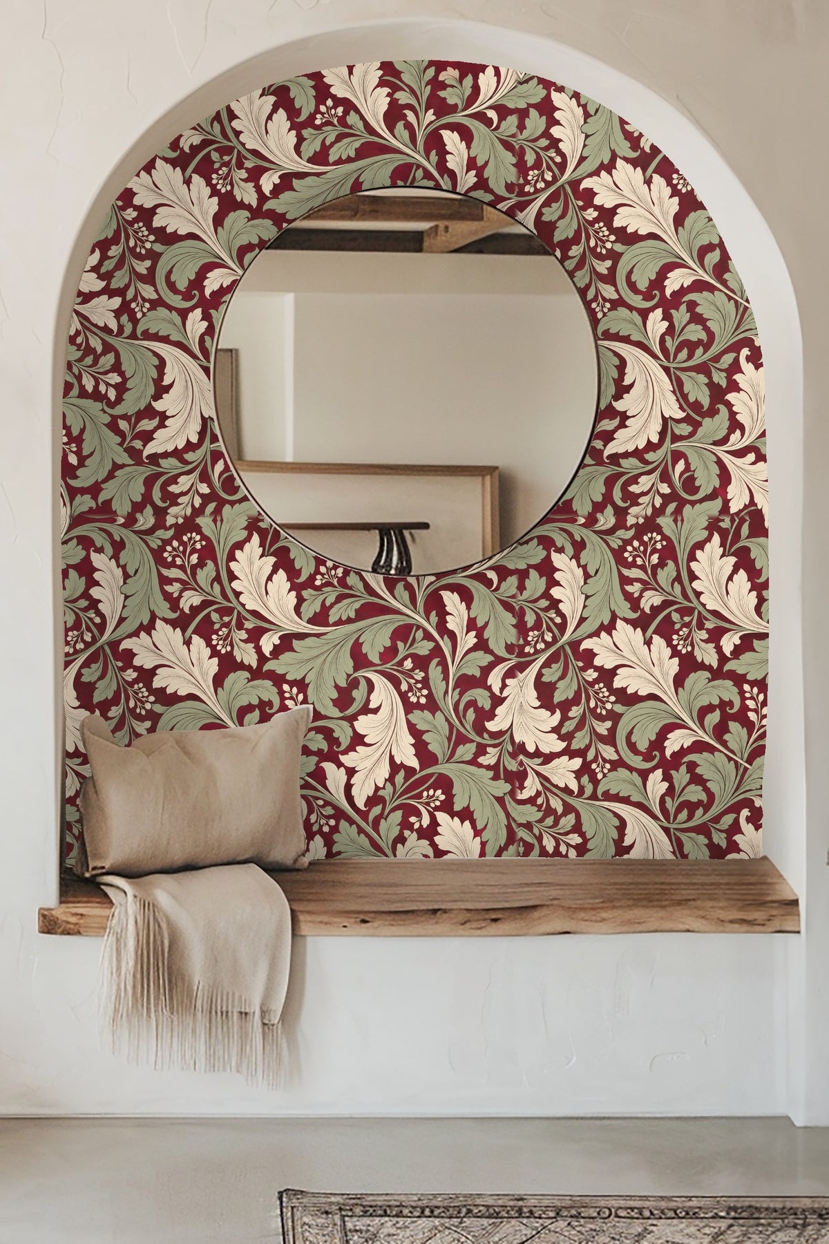 Room with orange sofa and large wall covered in crimson wallpaper with cream and sage acanthus leaf pattern