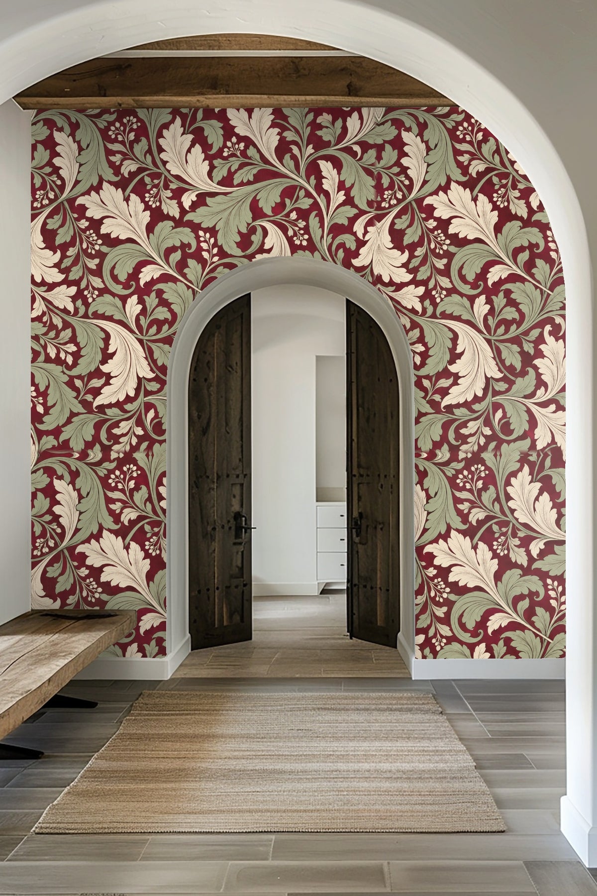 Wall mural with sweeping leaf motifs in pale cream and soft green over dark crimson