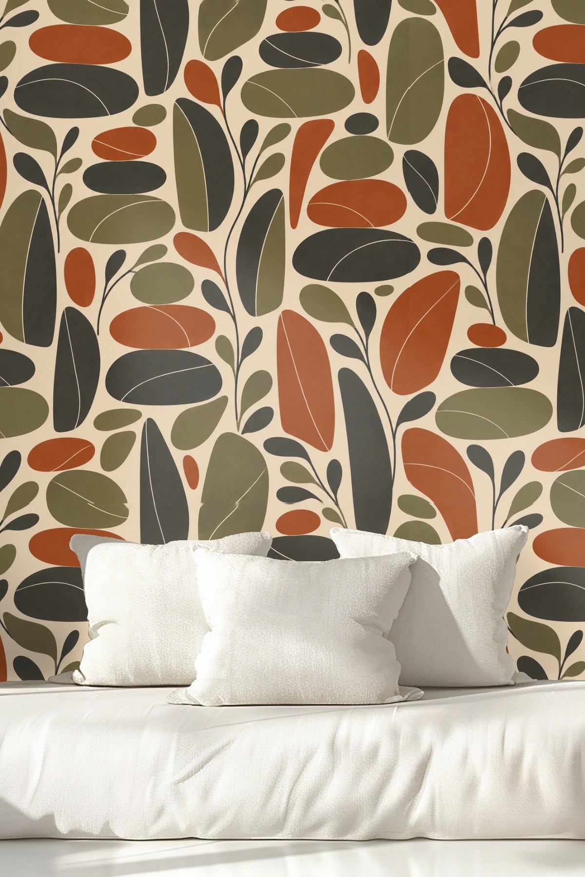 Living room corner with retro leaf wallpaper and green velvet stool.