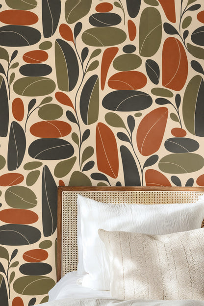 Abstract retro leaf wallpaper in rust, olive green, and charcoal on cream background.