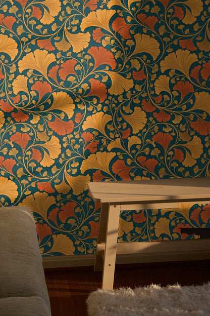 Laundry room with amber rust teal wallpaper behind white washer and dryer