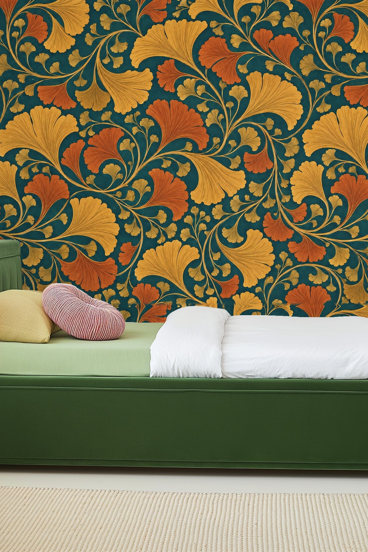 Rust and ochre ginkgo leaves swirling across teal wall