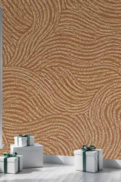 Natural light illuminating terracotta flowing line wallpaper in a cozy room.