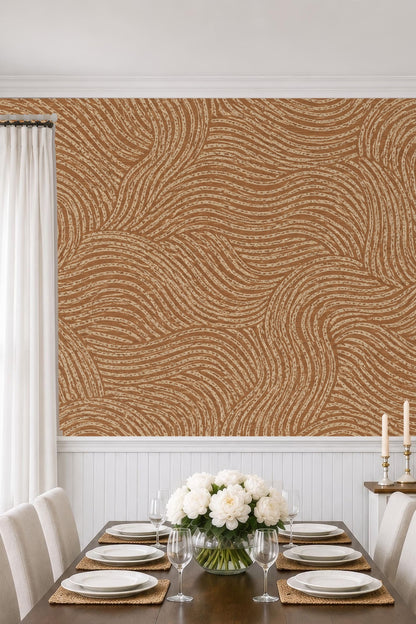 Close-up of wave-like pattern on wallpaper in terracotta and beige.