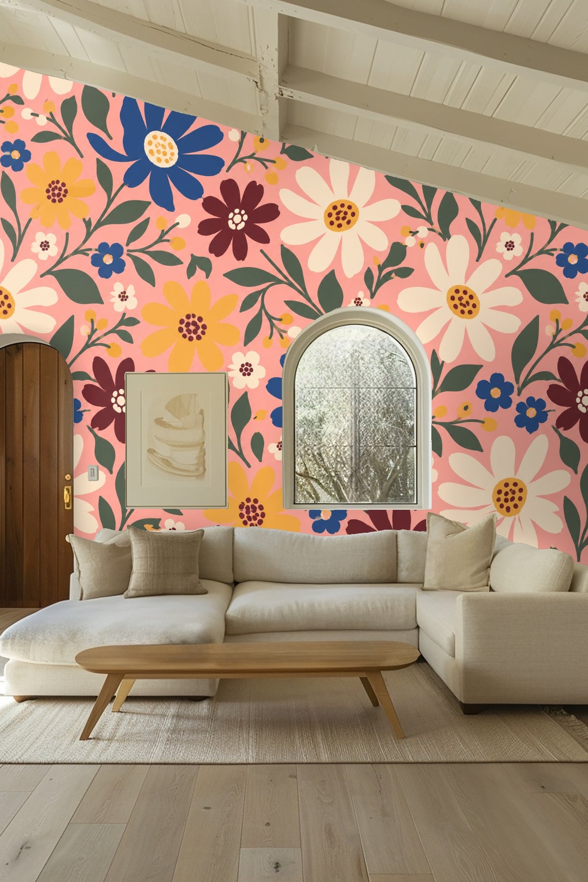 Detailed view of blue daisies with yellow centers and green foliage on a pink floral wallpaper