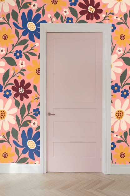 Cluster of maroon and mustard yellow flowers with rounded petals on a pale pink background wallpaper
