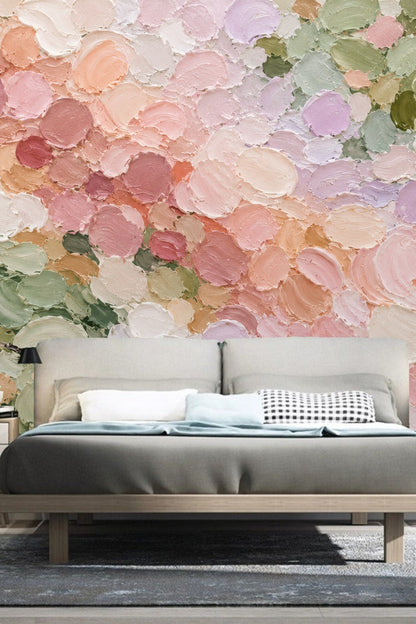 Close-up of impasto-style brushstroke wallpaper in soft pastel pinks and greens