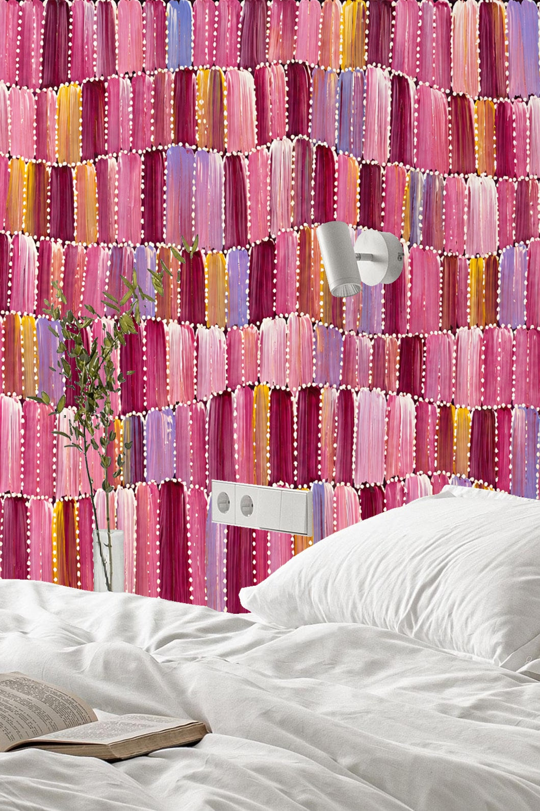 Close-up view of segmented brushstroke pattern wallpaper in pink, purple, and yellow tones